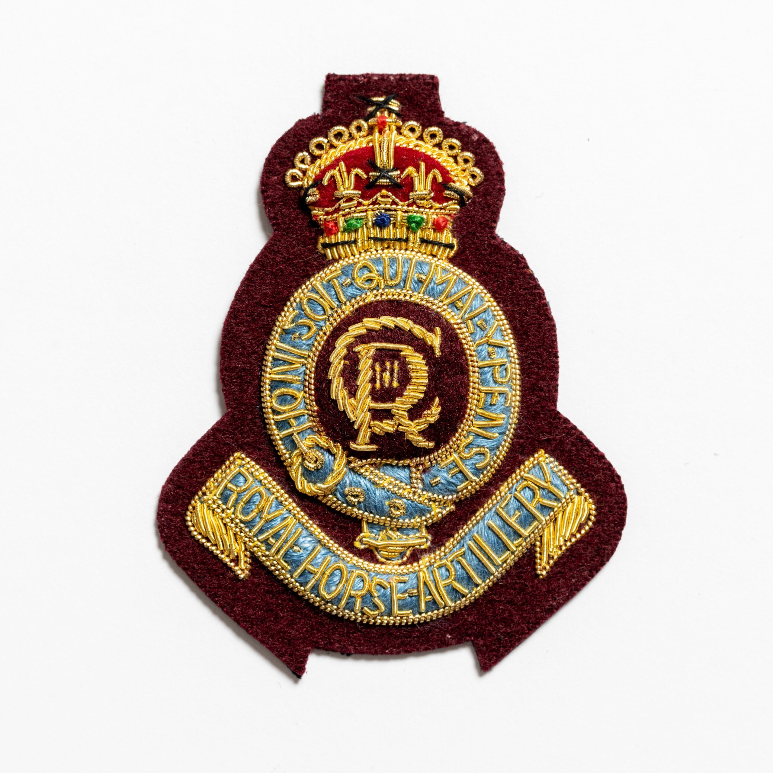 7th Royal Horse Artillery Beret Badge on Maroon 7th Royal Horse Artillery Beret Badge on Maroon