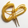 gold aiguillette with tags and netted tops scaled